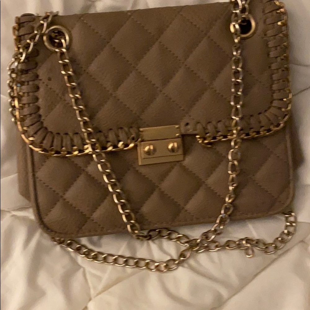 Handbag with gold straps